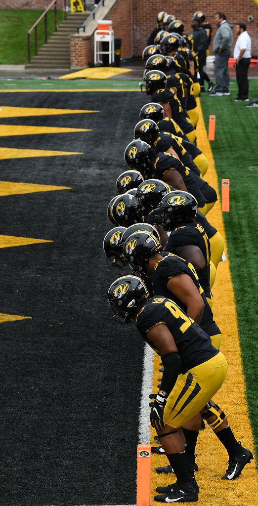 The Missouri Tigers stretch out before the game